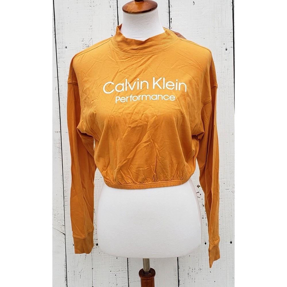 Calvin Klein Women's Size S Yellow Long Sleeve Short Activewear Shirt NEW